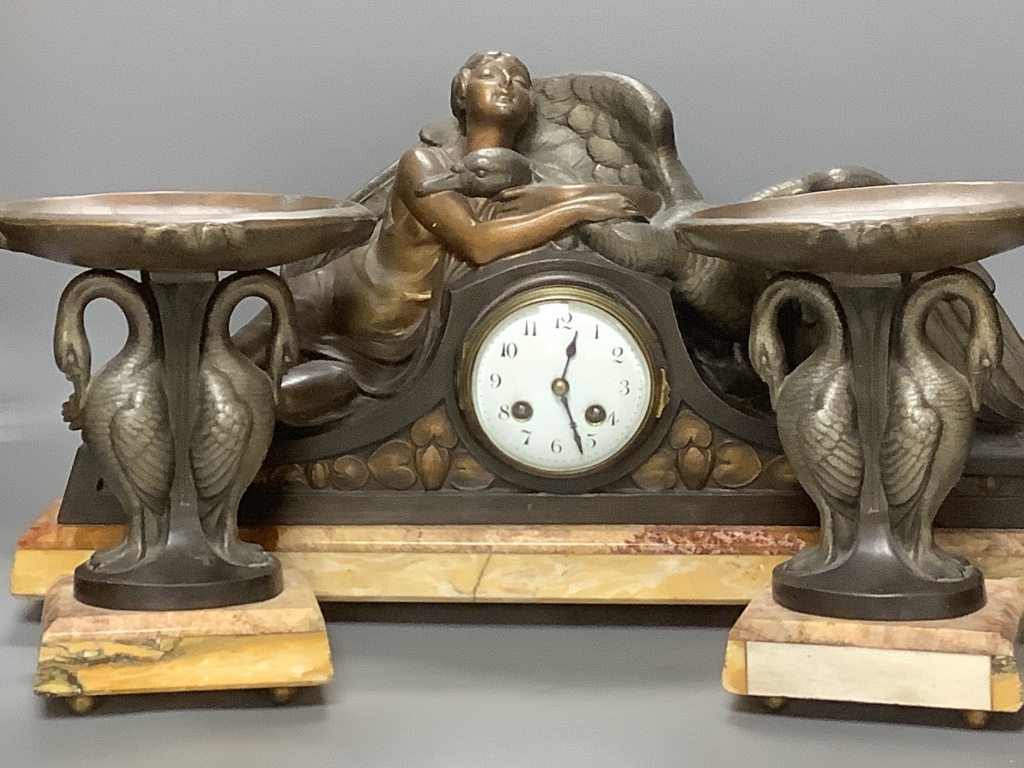 A large Art Deco patinated spelter and marble figural clock garniture, signed P. Seca, longest piece 58cm